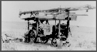 Various vehicles used in the 1931 drilling project featured in the previous two photographs.