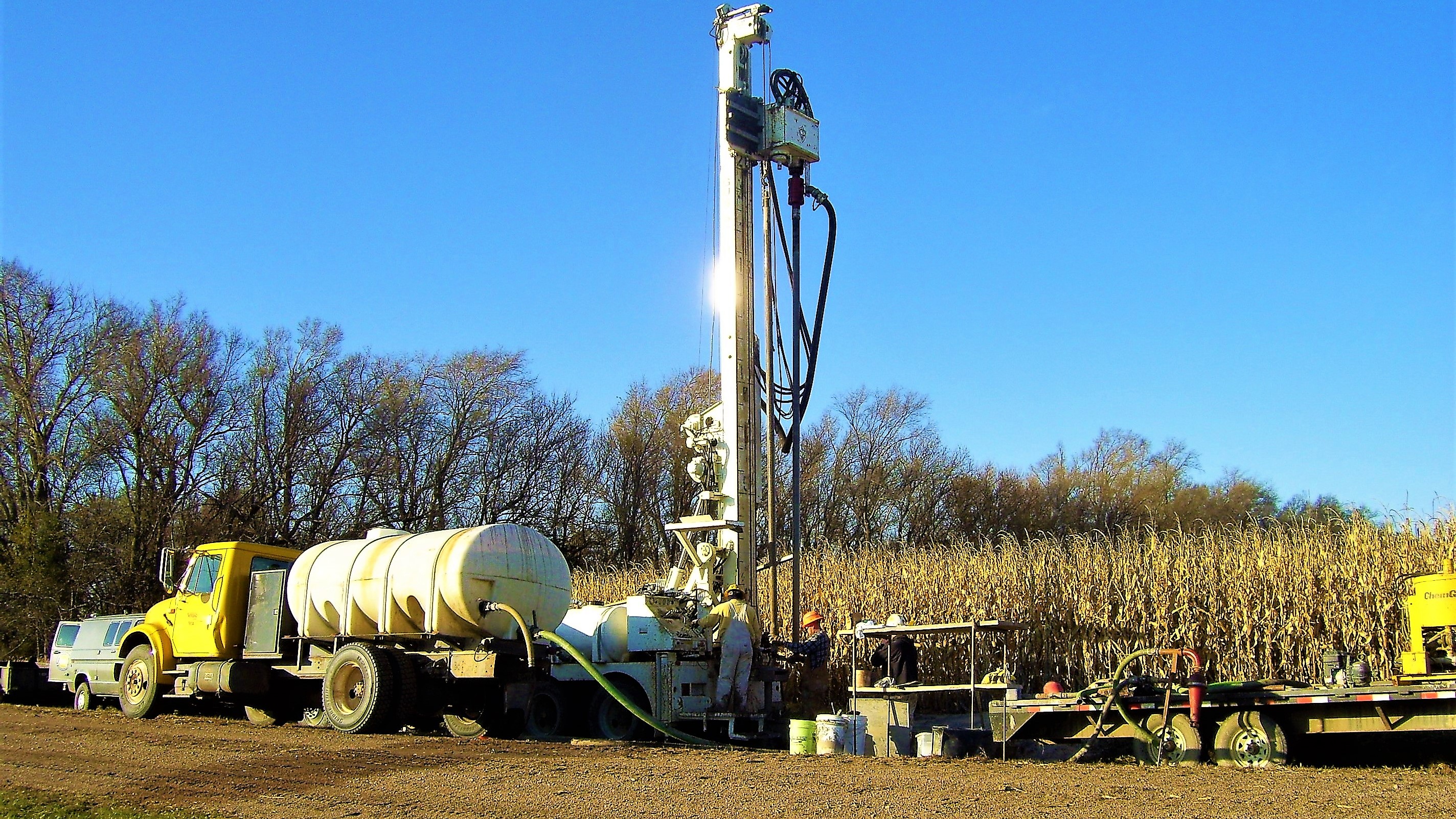 Geologists and drill operators using wireline drilling to recover core. 