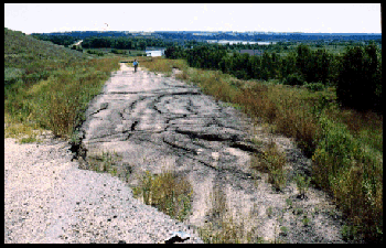Highway 14, Knox County, Nebraska. Close-up of the area featured in the green rectangle. Same Complex landslide as the above two photographs, but two years later. The highway dropped over six feet just after it was re-routed through the hills on the left.