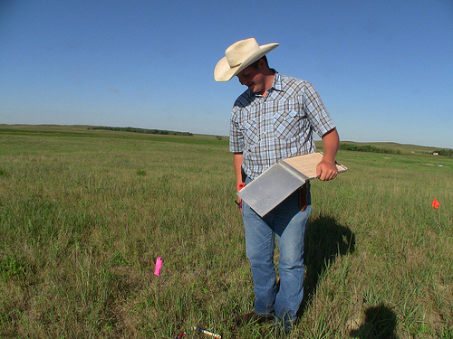 With detailed notes and pictures, Ben catalogs the vegetation at each site. The information will be used to determine the prairie chicken's preferred habitat, a potential resource for private landowners who hope to manage for and attract the native bird to their land.