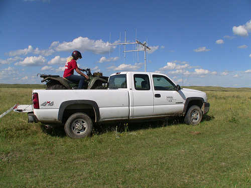 Senior Fisheries and Wildlife major Jessica Edgar uses radio telemetry to track prairie chicken hens and their broods. Many of the sites she monitors are on private ranch land. She travels the hilly landscape using a truck, then an ATV, and often walks miles on foot.
