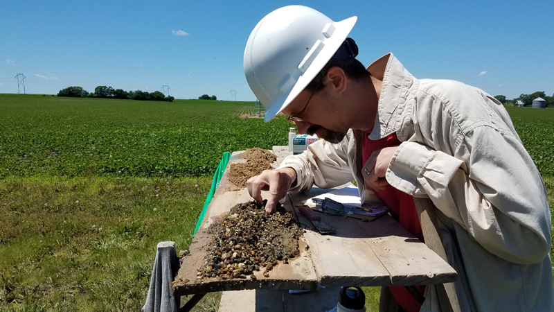 Inspecting Soil Sample