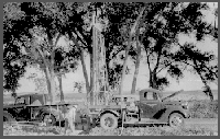 August 1, 1941, near Cambridge, Nebraska. Charlie Keech operates the mud digger.