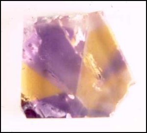 Ametrine Crystals, Anahi Mine, Bolivia, the color zonation is produced by making the cut perpendicular to the c-axis of the quartz crystal.