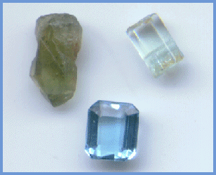 Rough and faceted aquamarine.