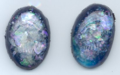 Foilbacks are opal imitations that include iridescent flakes of mica and metal foils in a plastic matrix.