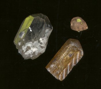 Topaz Crystals. Two large crystals are from Brazil. The small one is from Utah.