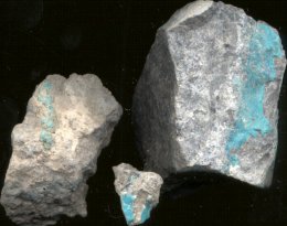 Turquoise in weathered ryolite. This is the kind of turquoise from which reconstituted turquoise is derived.