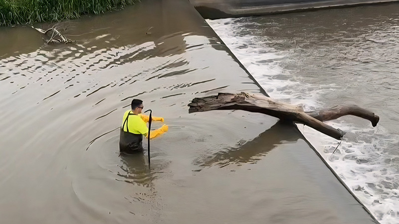 Carstens clears debris from a lake
