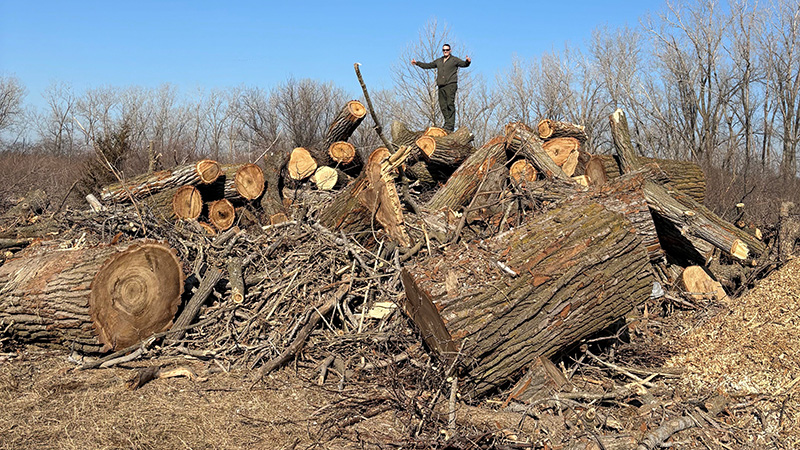 Carstens stands on storm debris