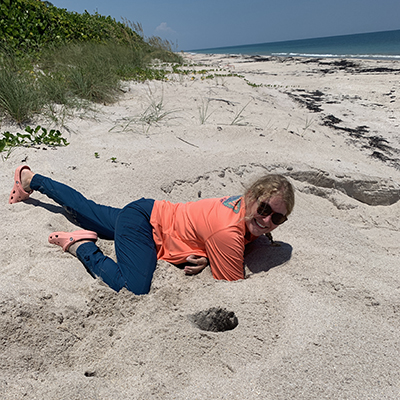 Sydney digging in a turtle nest for eggs