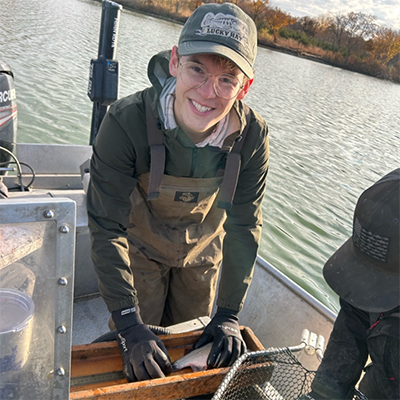 Jacob Vankat measures the length of a white perch