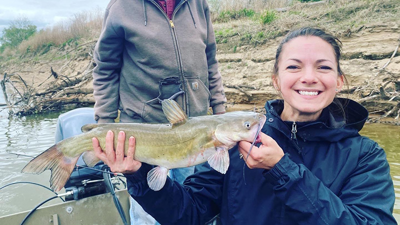 Rene Martin shows off catfish she caught