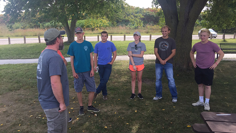 Chris Chizinski (left) with students