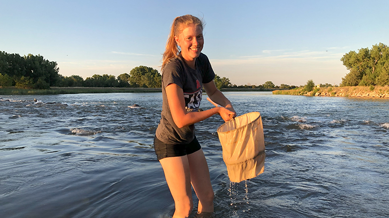 Kara Kniep catches crayfish