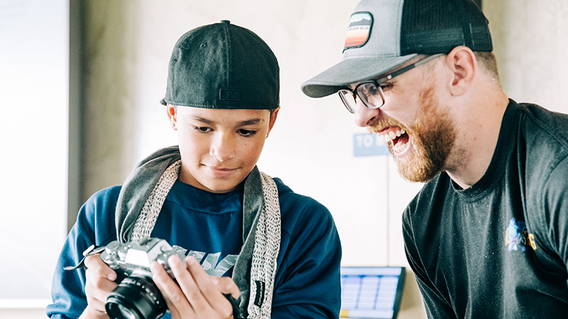 Zach Schafer with student and camera