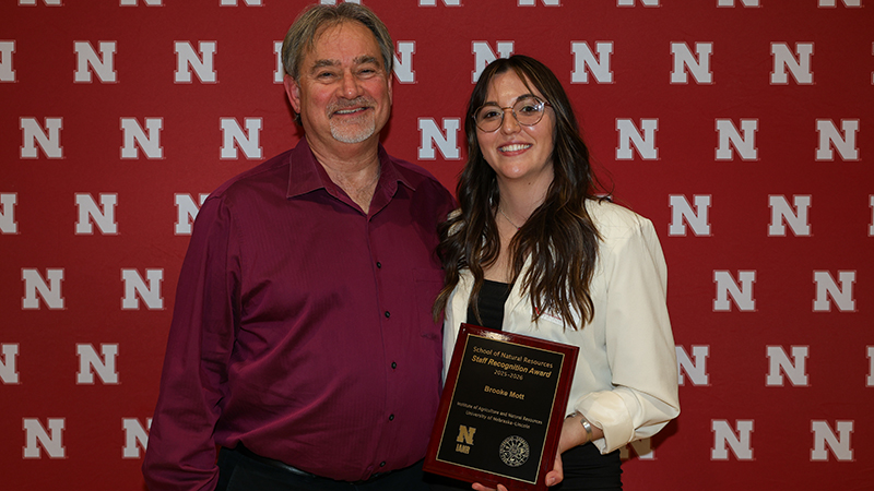 Brooke Mott  and Mark Burbach with award