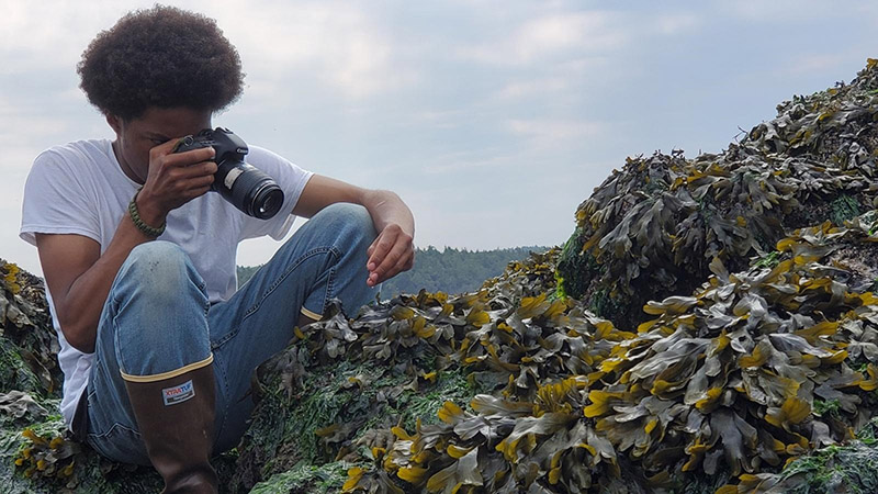 Pierre takes close-ups of crabs on Yellow Island