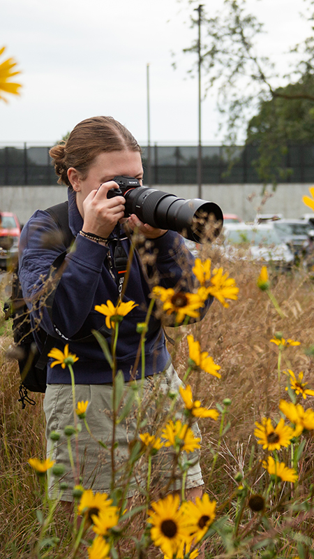 Student taking photo in Hardin Prairie