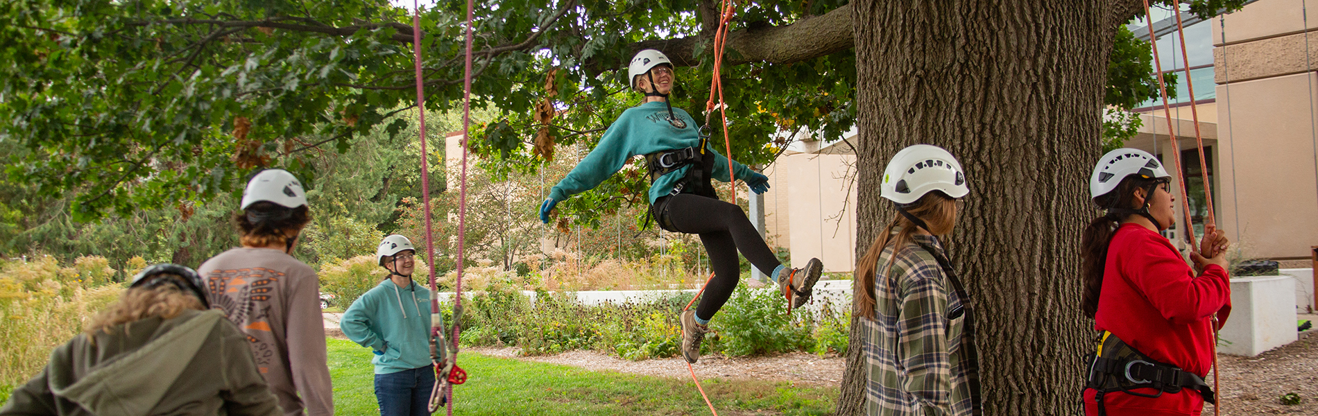 Six students preparing for Tree Climbing