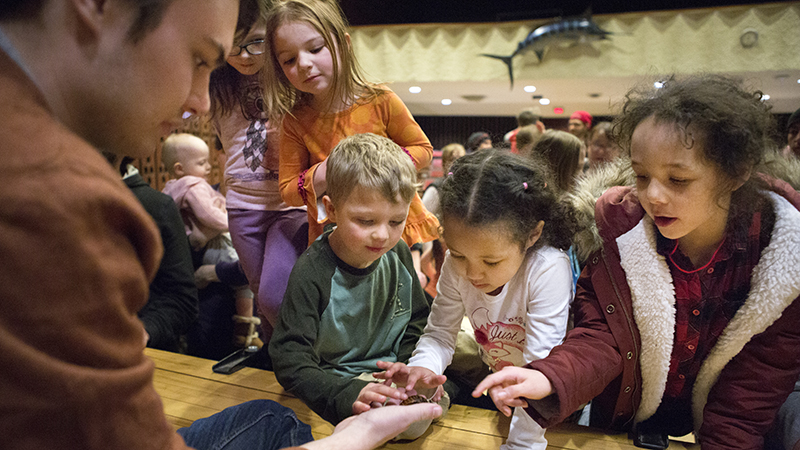 Student working with children